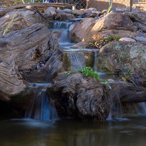 Residential Pondless Waterfall with Rock and Wood