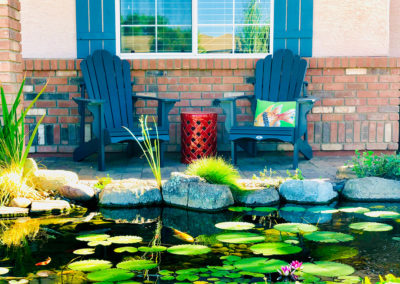 Koi pond with chairs and lily